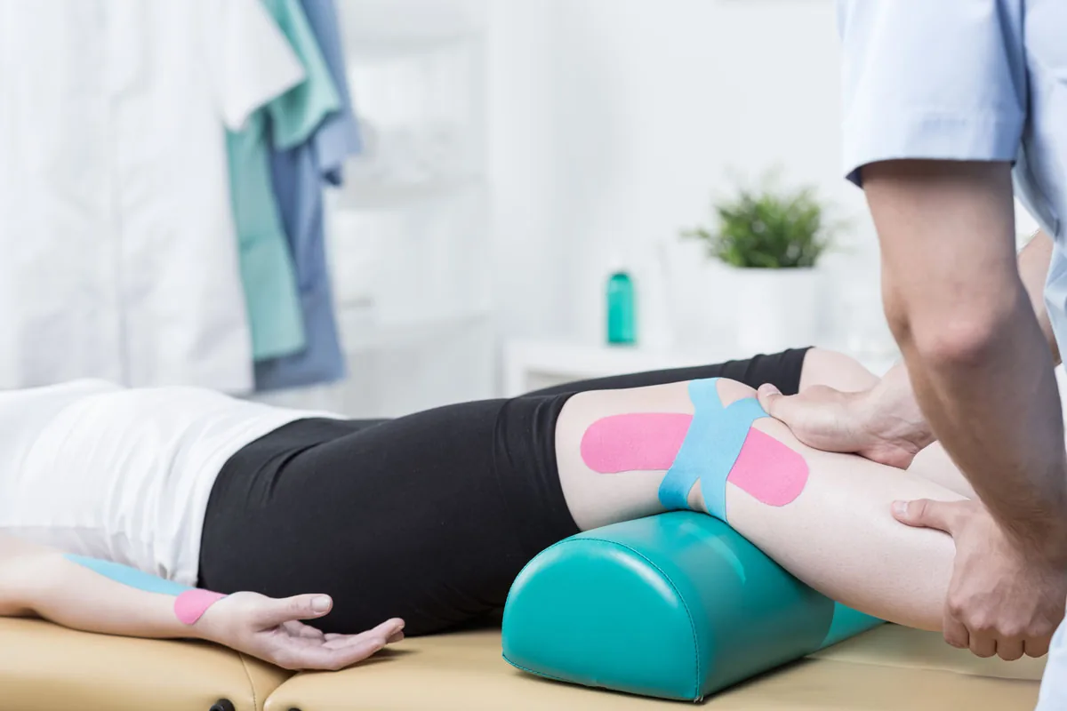 Clinician reviewing a workstation setup during an ergonomic assessment