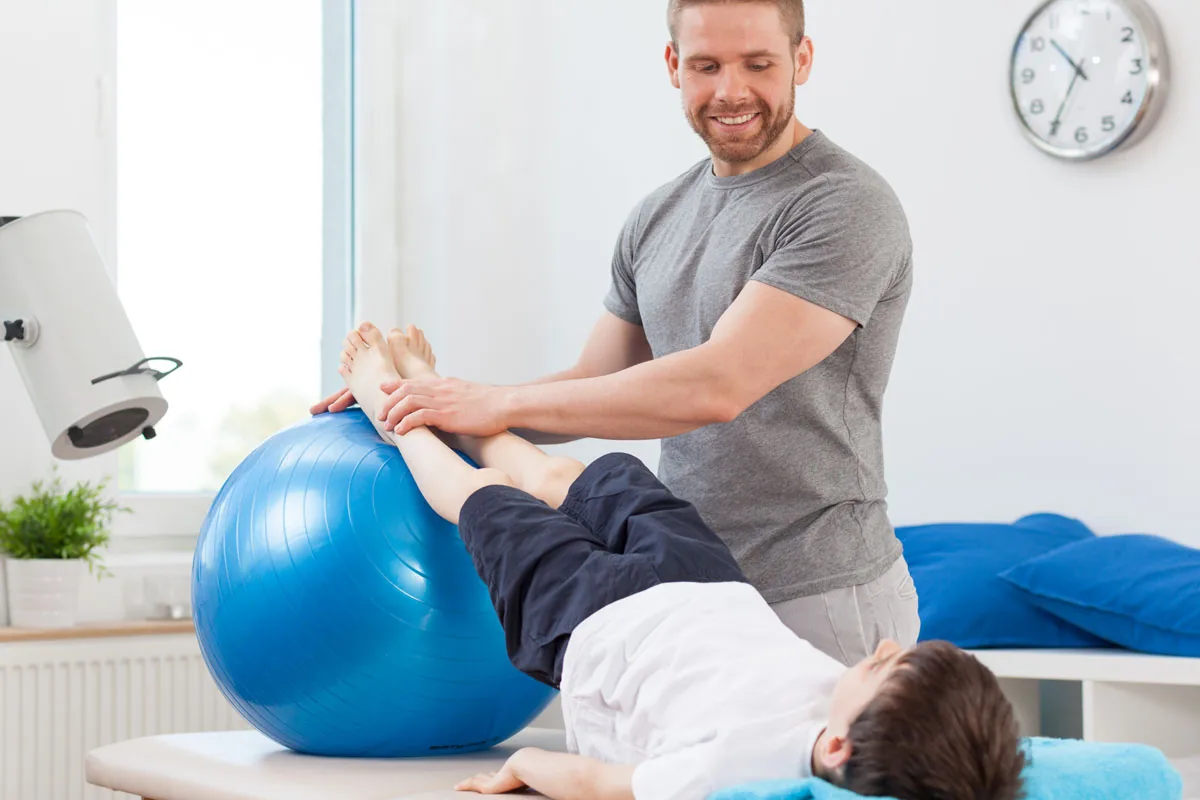 Patient performing a guided core stabilization exercise on a mat