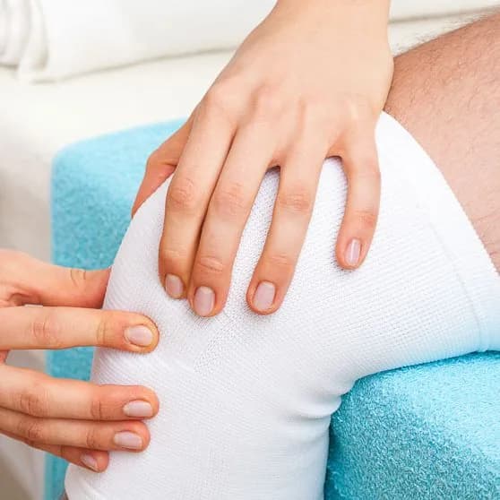 Physiotherapist providing hands-on manual therapy to a patient at the clinic